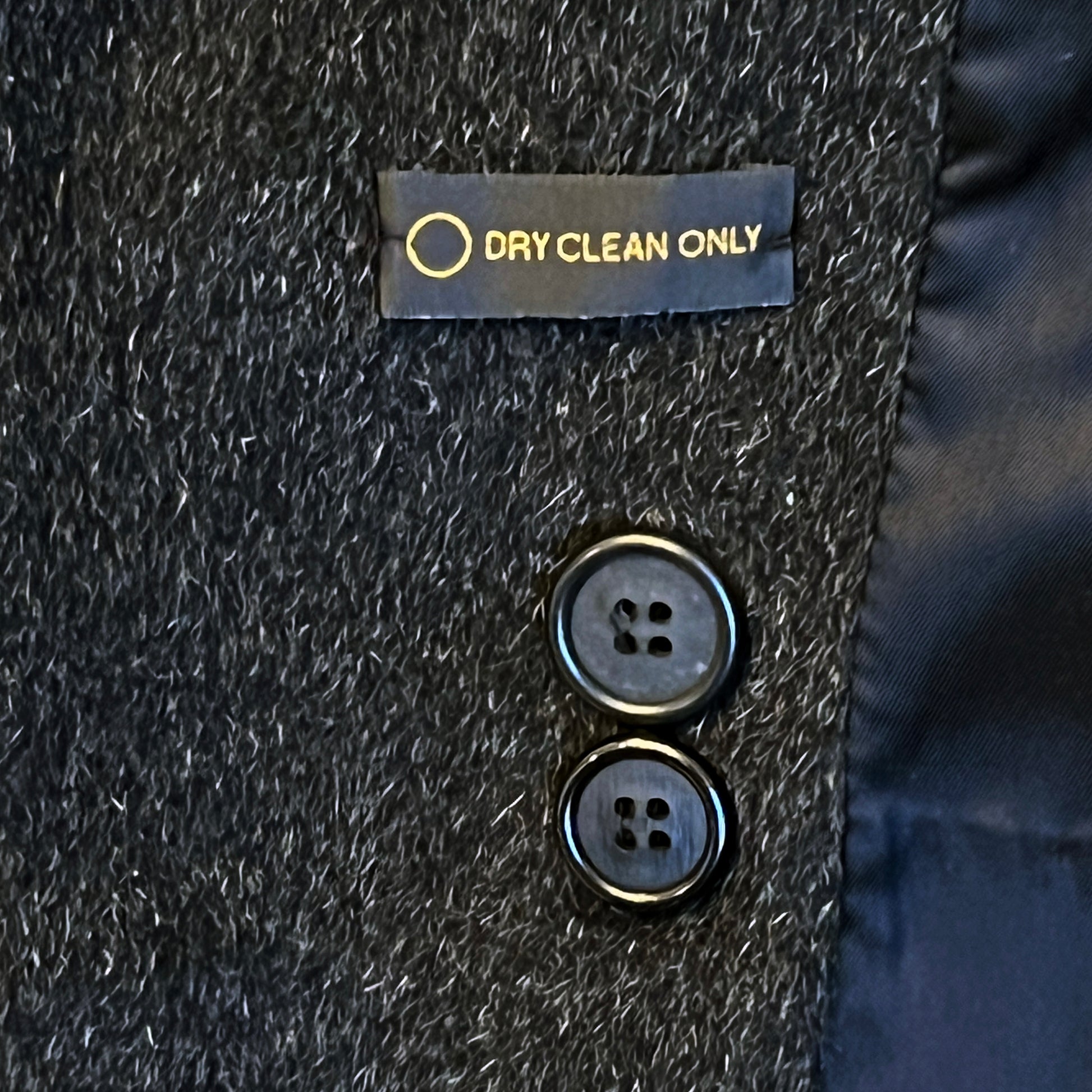 Dry-clean-only-sign;-extra-buttons