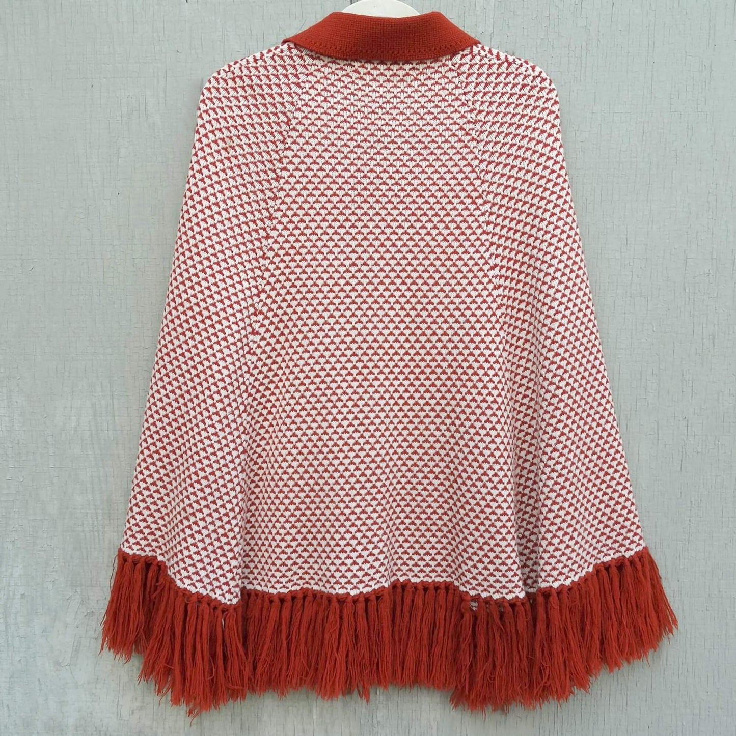 Sweater-Bee-Cape by-Banff.-Orange-and-White-Patterned.-Mother-of-Pearl-Buttons.-Fringed.-Shop-eBargainsAndDeals.com.