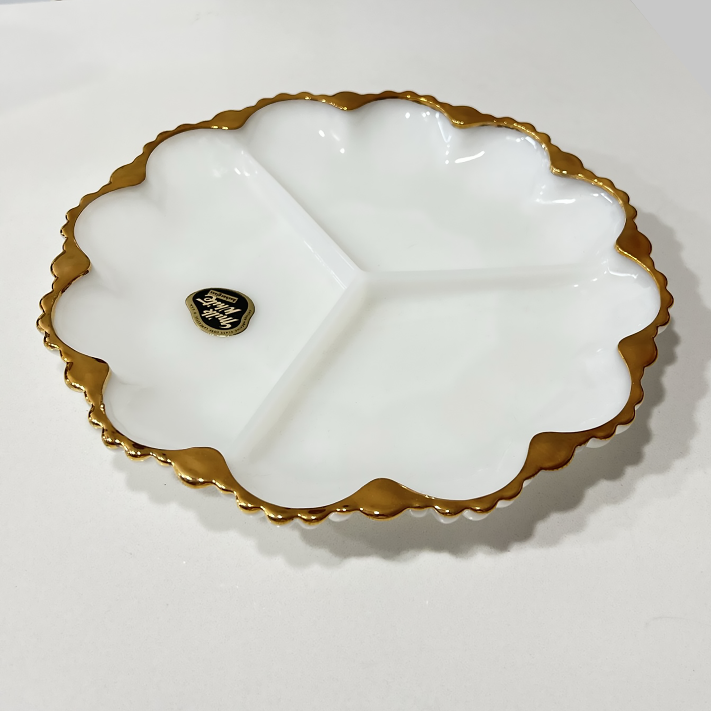 Anchor-Hocking-white-milk-glass-round-serving-plate-with- three-sections, ,and-gold-trim. Angled-view. Shop-eBargainsAndDeals.com-or-Etsy.